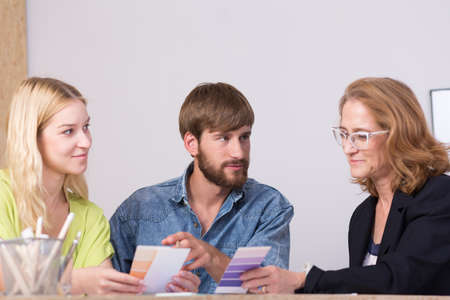 Interior designers discussing new ideas at the tableの写真素材