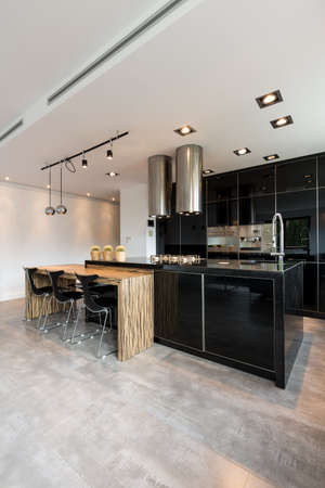 Black and white kitchen in modern spacious house