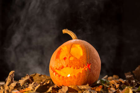Pumpkin decoration with funny smile in the darknessの写真素材