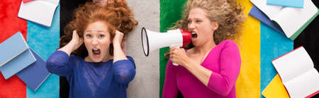 Anger before session- female student screaming into megaphoneの写真素材