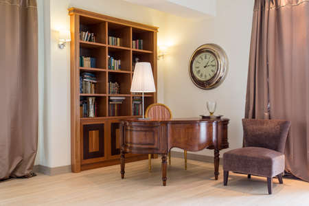Elegant stylish room with wooden bookcase and old grand pianoの写真素材