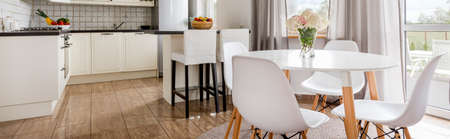View from the light, modern dining room at open functional kitchenの写真素材