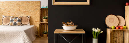 Spacious autumn room design with natural wood decorationsの写真素材