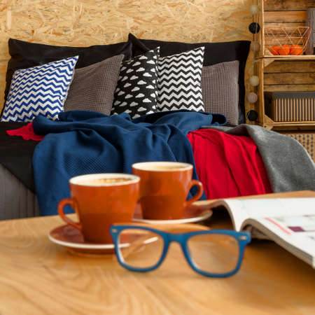 Coffee, glasses and book on the tableの写真素材