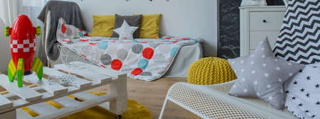 Toy rocket on the recycled table in cozy child roomの写真素材