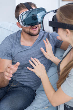 Young man and woman using Virtual Reality Glassesの写真素材