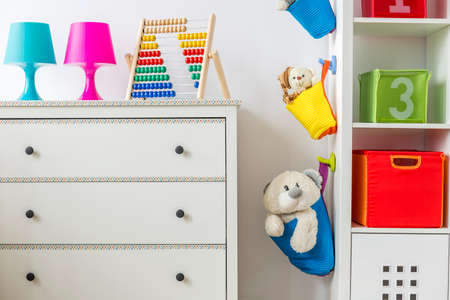 View of the part of the child room with white dresser and cabinetの写真素材