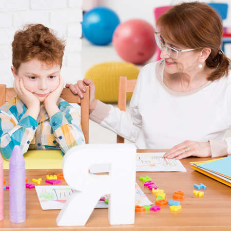 Boy with problem at school having extra lesson
