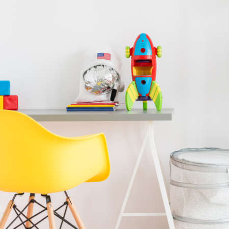 Part of a cool teenager room with desk and chairの写真素材