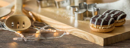 Close-up of sweet cookies on the wooden tray in the kitchen