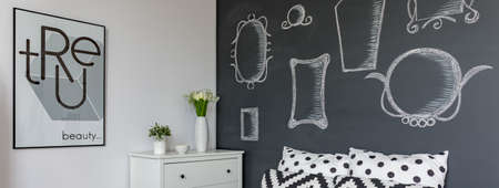 Black and white room walls with mirror drawingsの写真素材