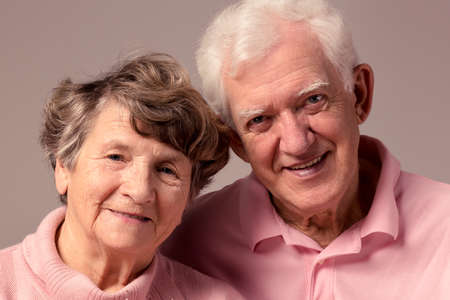Portrait of senior couple standing close each other and smilingの写真素材