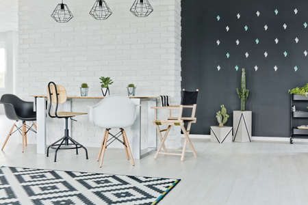 Dining room with chalkboard and decorative brick wallの写真素材