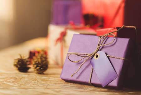 Beautiful christmas gift packed in purple paperの写真素材