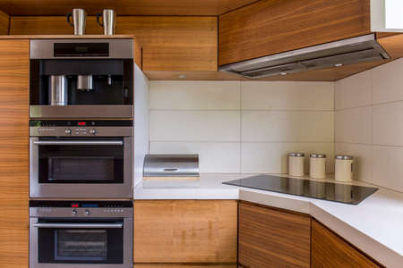 Close-up of modern kitchenette with wooden furnitureの写真素材