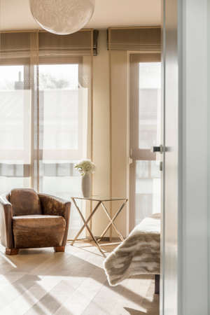 Area of bright room with comfortable armchairの写真素材