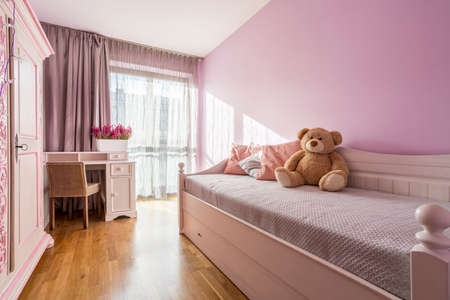 Lilac bedroom of a child with bedの写真素材