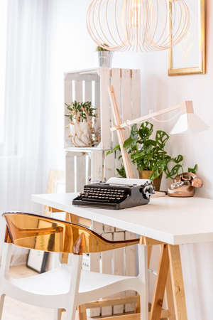 Home office area with typewriter on a deskの写真素材