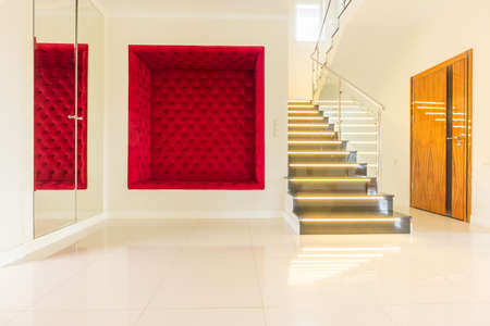 Bright house corridor with modern stairsの写真素材