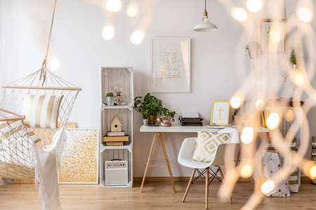 Living room with lights and hammockの写真素材