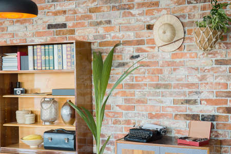 Wooden rack at the brick wall backgroundの写真素材