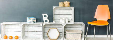 Black room with modern design of wooden boxes white shelfの写真素材