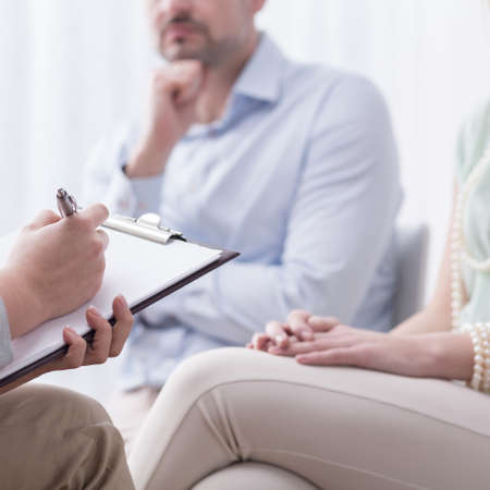 Professional therapist is listening to her patientsの写真素材