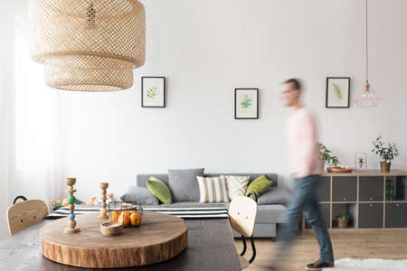 Man in bright dining room interiorの写真素材