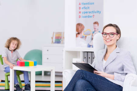 Woman therapist leading occupational therapy for children with ADHD