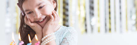 Young and smiled girl celebrating her Birthdayの写真素材