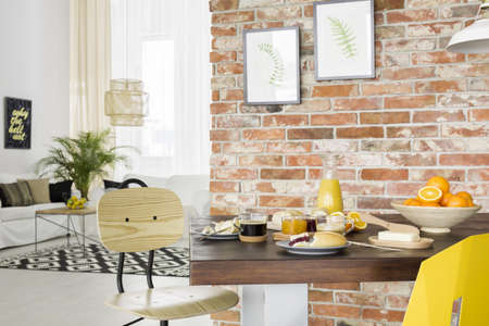 Industrial style dining room with wood table and chair