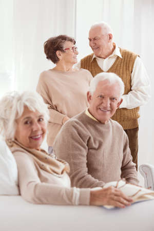 Two older marriages meeting at day-care centerの写真素材