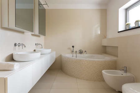Creamy bathroom with minimalist furnitureの写真素材