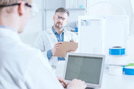 Scientists at laboratory using new 3d printer