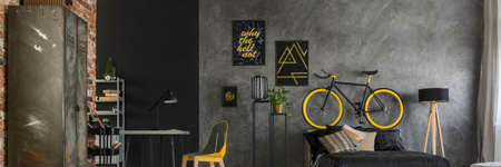 Grey and yellow bedroom with modern accessoriesの写真素材