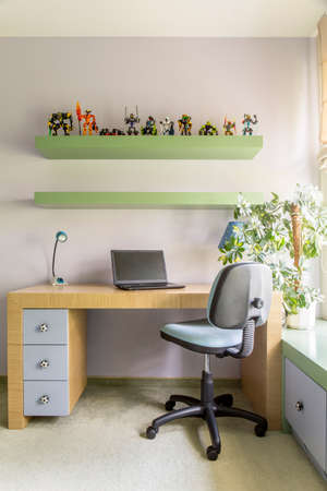 Wooden desk in study room for teenage boyの写真素材