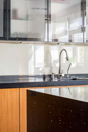 Marble wheat on a wooden units in contemporary stylish kitchenの写真素材