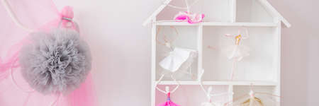 White doll house with toy ballerinas in little girl's roomの写真素材