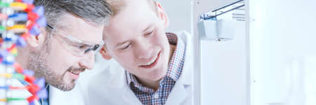 Two chemists working in their modern laboratory