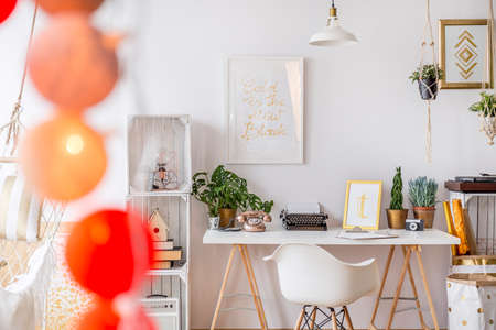 Modern designed white apartment with white desk and boxes shelfの写真素材