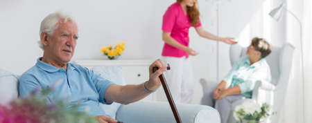 Elderly people with rod at the medical centre