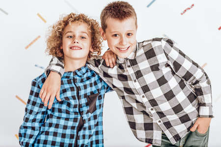 Two happy boys wearing shirts and smilingの写真素材