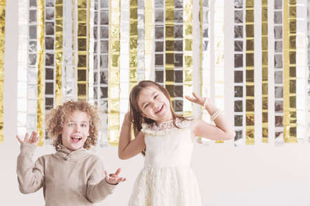 Small, smiling boy and girl having fun togetherの写真素材