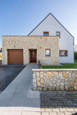 Modern house exterior with natural stone elevationの写真素材