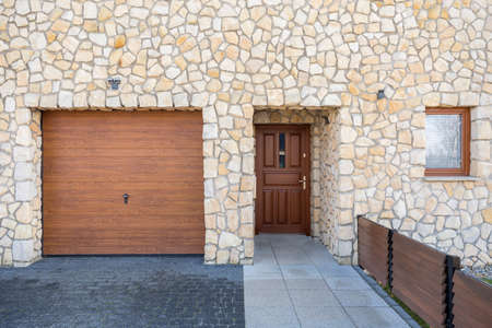 Modern stonework front home entrance and garageの写真素材