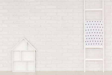 White home interior with brick wall, ladder and house shelfの写真素材