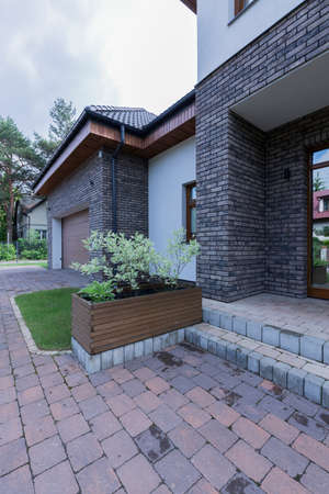 Modern front house entrance with paving stone doorwayの写真素材