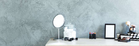 Panoramic view of room with grey wall and makeup tableの写真素材