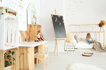 Modern and cozy scandi room of a little girlの写真素材