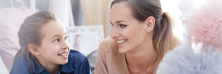 Pretty young women from two generations as best friends